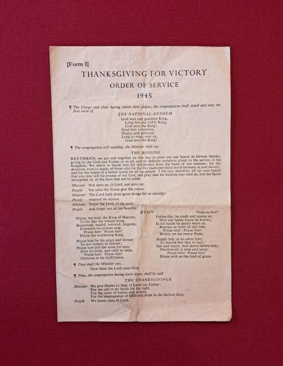 A 'Thanksgiving for victory, order of service' leaflet from the national family bible. Set on a dark red background