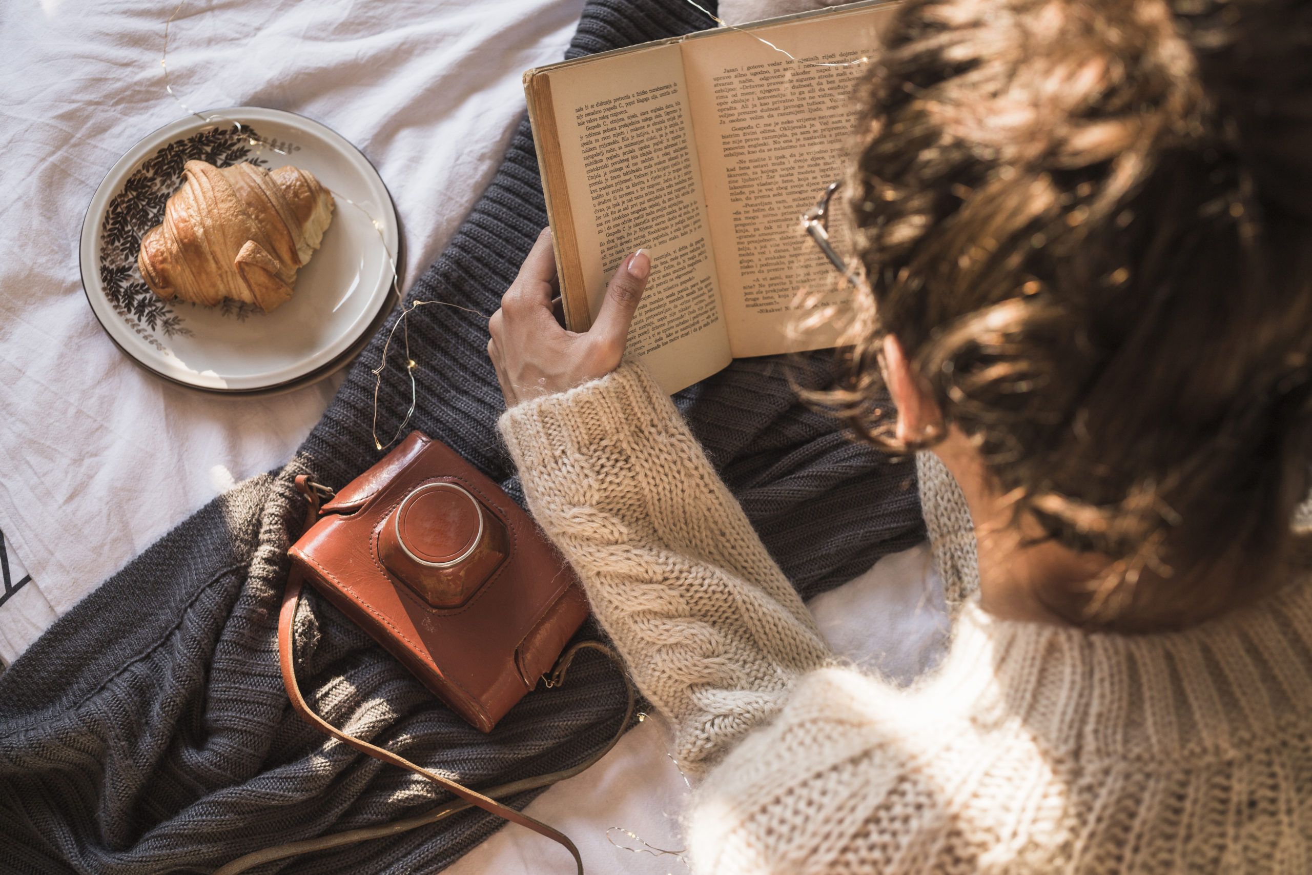 Woman reading with coffee