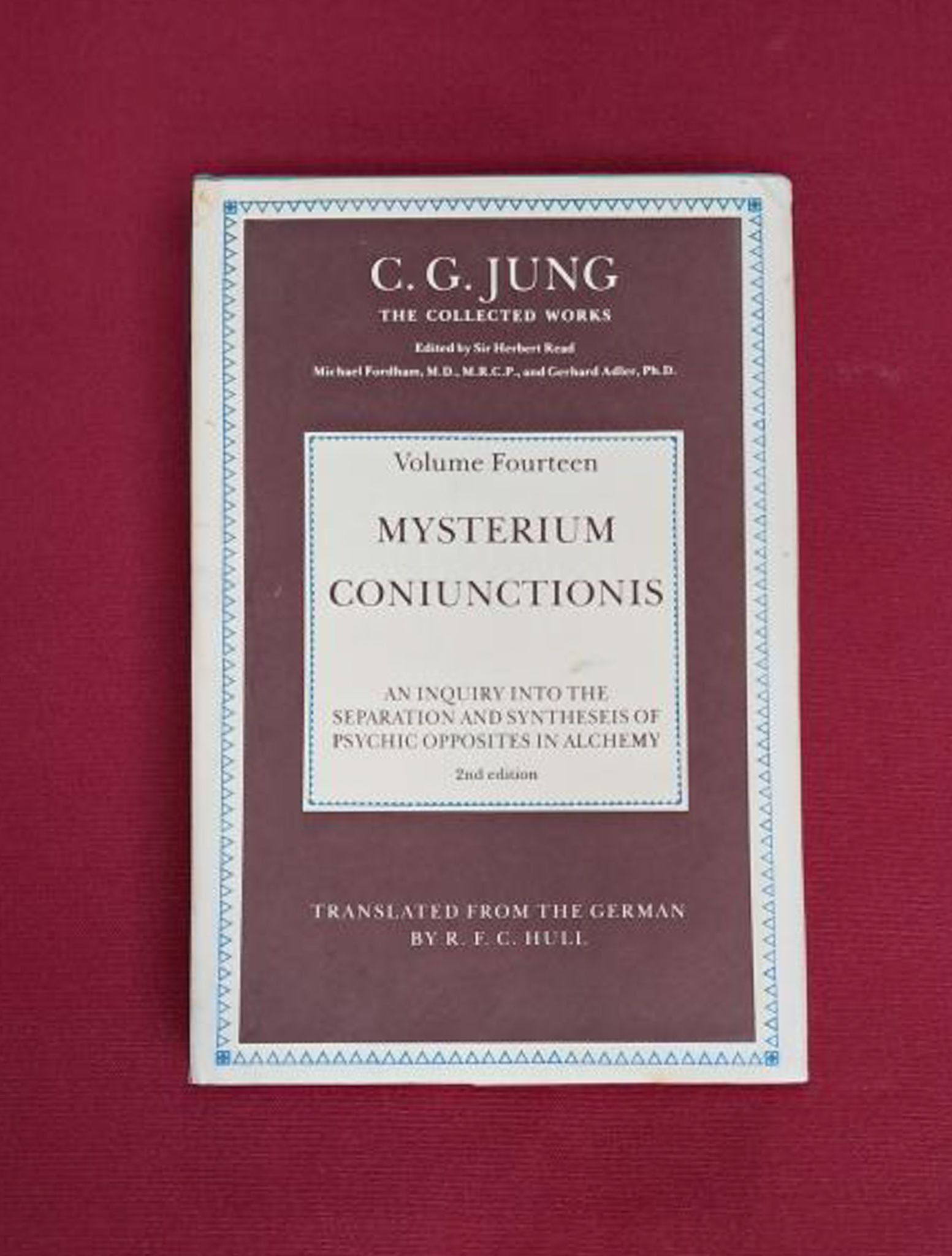 Mysterium Coniunctionis. Dark maroon cover with off white text boxes